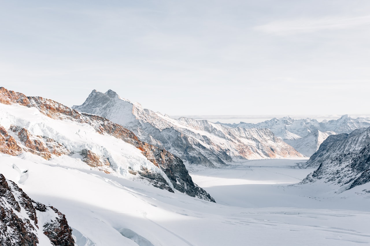 Snow-covered mountain range under a clear sky