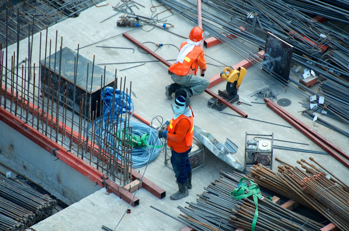 Construction crew working on a concrete deck with rebar